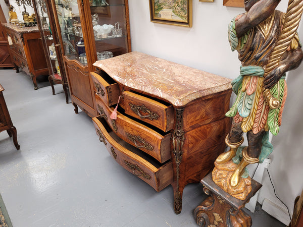 Beautiful French Louis XV style Kingwood inlaid marble top four drawer commode. It has decorative mounts and has been sourced from France. It is in good original detailed condition.