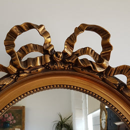Antique French Gilt Oval Shape Mirror With Ribbon Crest