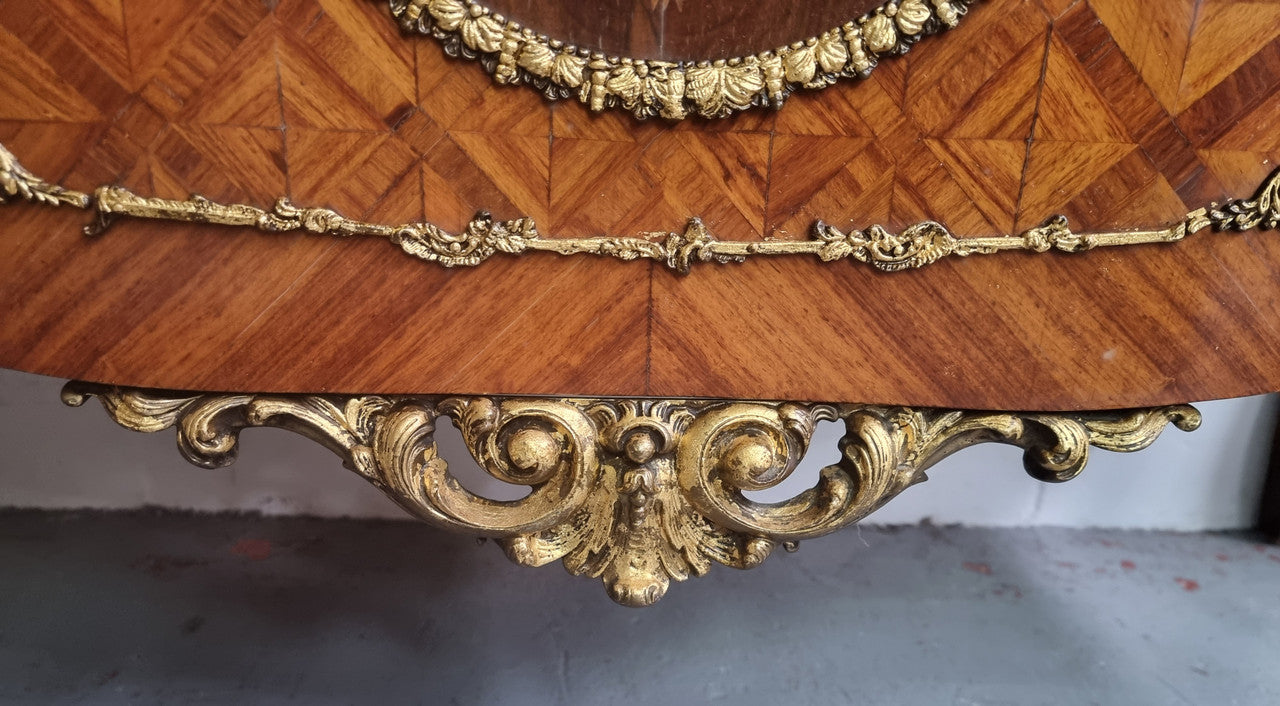 Stunning Louis XV style ormolu and marquetry marble top commode with two drawers. It has an amazing thick marble top and it is in good original detailed condition.