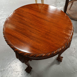 A beautiful round Mahogany Chippendale style coffee table with a glass top. In good original detailed condition.