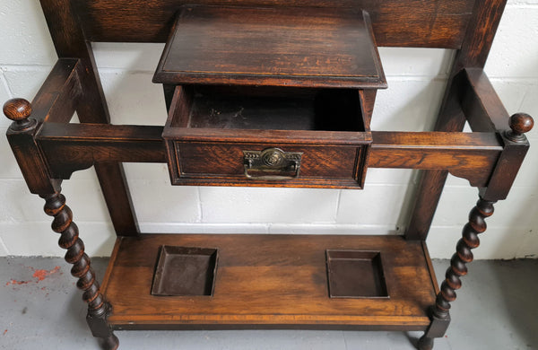 Beautiful Oak Antique Jacobean hall stand, with barley twist leg and a drawer for storage in very good original detailed condition condition.