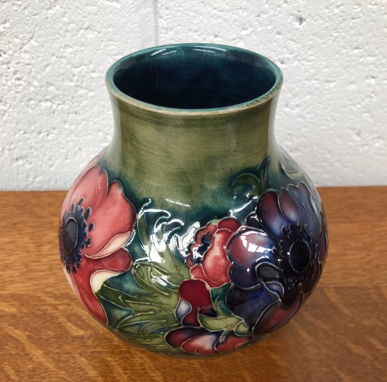 Anemone pattern hand-painted Moorcroft vase, in good condition.