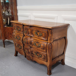 French Antique Louis XIV style Oak wooden top commode. It has a stunning serpentine bombe shape front along with amazing handles and carvings. It comes with three beautiful keys as pictured and comes with working locks. It has been sourced from France and in good original detailed condition.