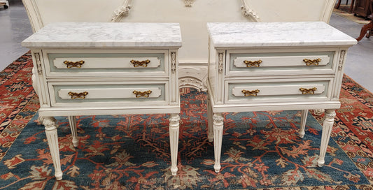 Attractive pair of Vintage French Louis 16th style two drawer marble topped bedsides. They have been sourced from France and are in good original condition.