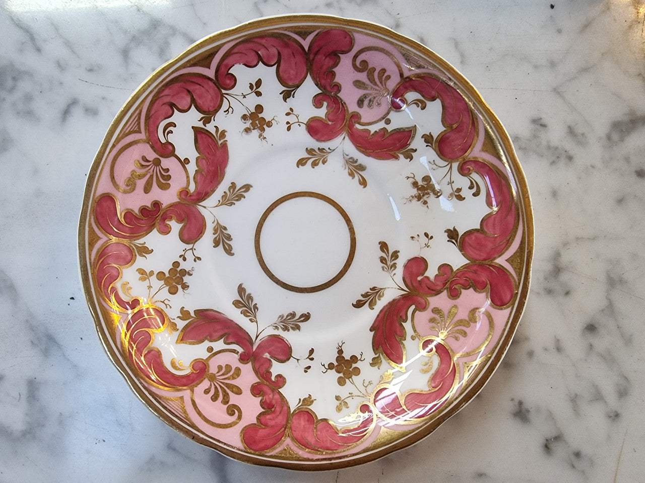 Early Victorian Cup and Saucer patterned in pink and gold tones. In original condition please view photo's as they form part of the description.