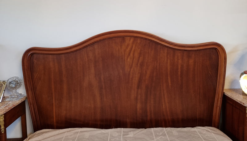 Beautiful French Walnut Louis XV style queen size bed with carving on the feet and in good original detailed condition.