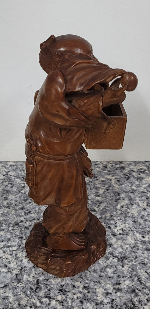 Exceptional Japanese Meiji period boxwood carving of a Peach Seller. Circa 1880's and it is signed to base. It is in good original condition, please view photos as they help form part of the description.