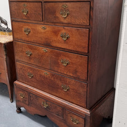 Early 19th Century English Oak chest on stand. It has been sourced in France and has plenty of storage space with eight drawers. In good original detailed condition.