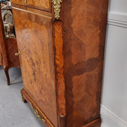 Elegant French transitional style Walnut & Kingwood Salon cabinet. It has beautiful marquetry inlay, a marble top and decorative ormolu mounts. Sourced From France and is in good original detailed condition.