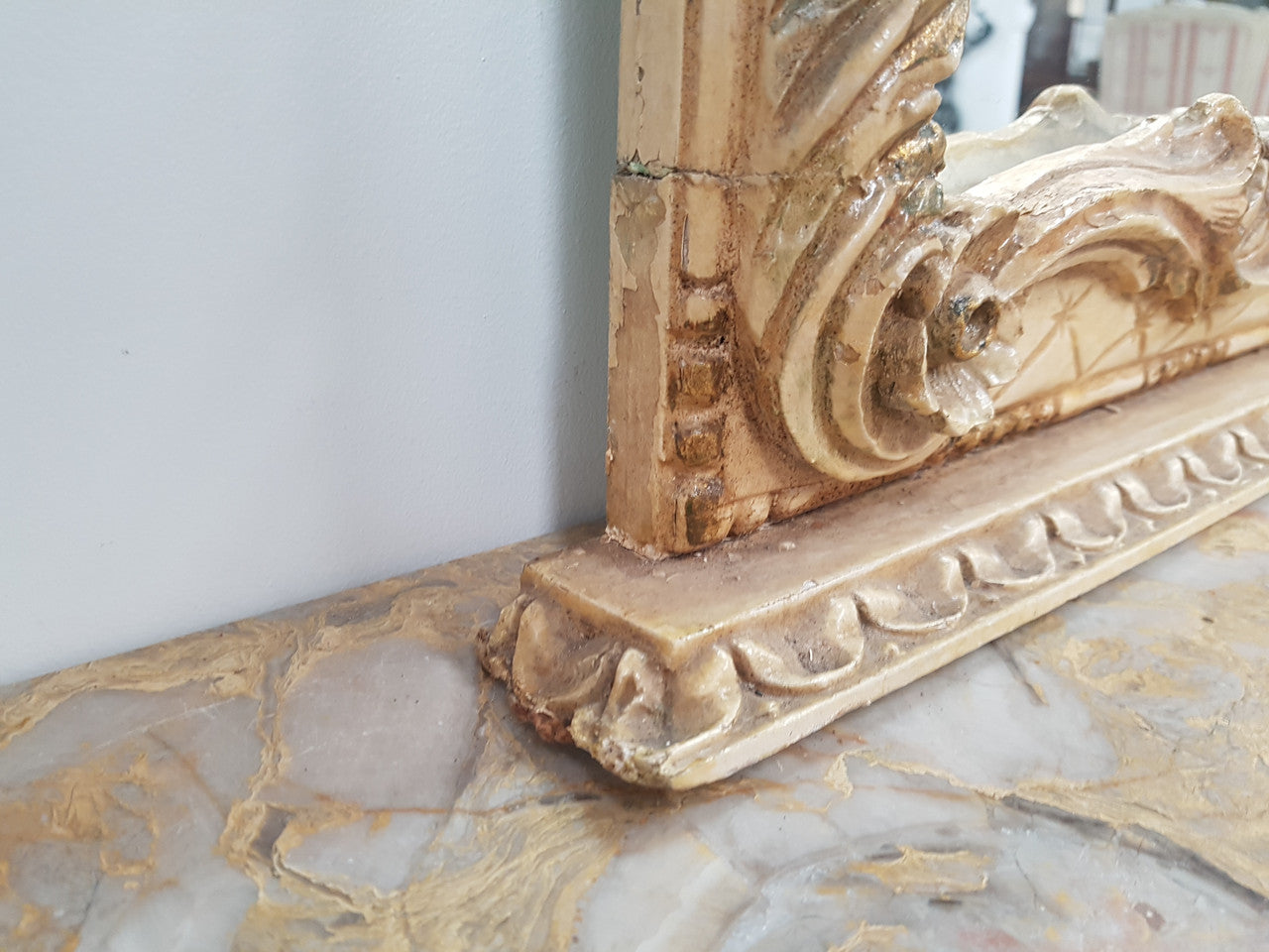 Beautifully carved Italian Rococo style painted console/hall table and mirror. An amazing coloured marble top showing sections of gold veins and is in good condition. Mantle mirror is retaining it's original mirror and showing ages spots.