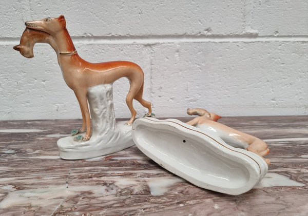 Superb pair of Staffordshire Pottery Greyhounds both with rabbits/hares in their mouths. In good original condition with no cracks or chips, please view photos as they help form part of the description.