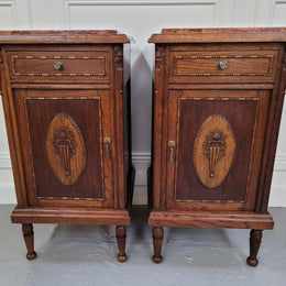 Pair of French Art Deco Oak and rouge inset marble top bedside cabinets. They have one drawer and one cupboard with elegant carving on the door. They have been sourced from France and are in good original detailed condition.