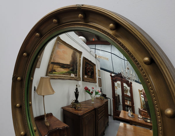 Large round French gilt framed convex mirror. It is a hard to find size with a total diameter of 67 cm. It has been sourced from France and is in good original condition.