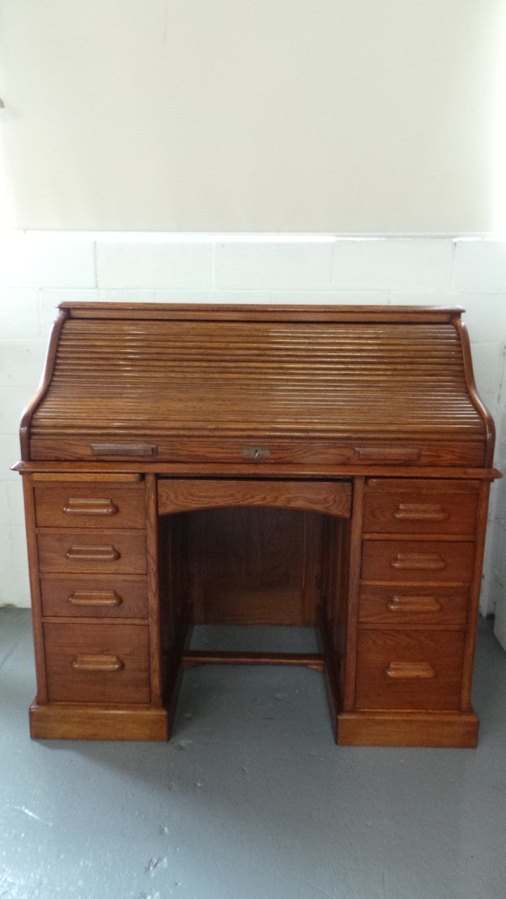 An Antique English Oak Roll Top Desk