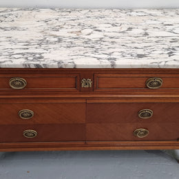Louis XVI style Mahogany marble top cupboard. It has two drawers at the top and two doors at the bottom all with decorative handles and mounts. Stunning white marble top and all in good original detailed condition.