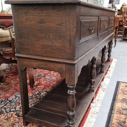 A very hard to find Vintage English kitchen dresser base of narrow proportions, sourced from France. In good original detailed condition.