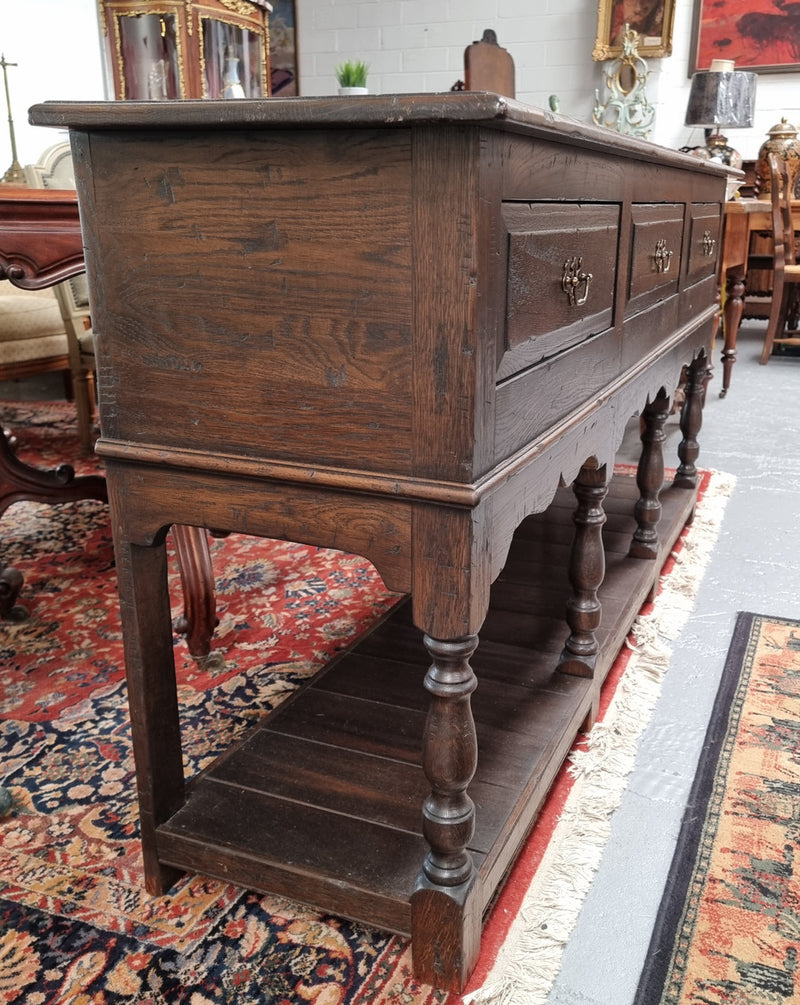 A very hard to find Vintage English kitchen dresser base of narrow proportions, sourced from France. In good original detailed condition.