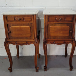 Pair of stunning Louis XV style French Walnut white marble top bedside cabinets. They have one drawer and a cupboard that is marble lined. The marble has been polished and they are in good original detailed condition.