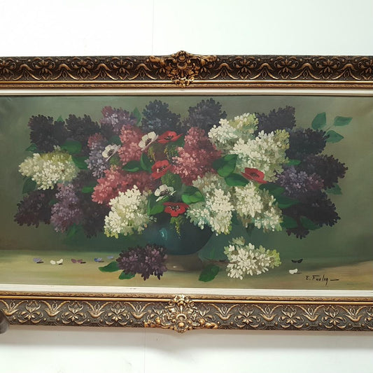 An Antique framed floral painting of lilacs in a vase on canvas, signed and in fantastic original condition.
