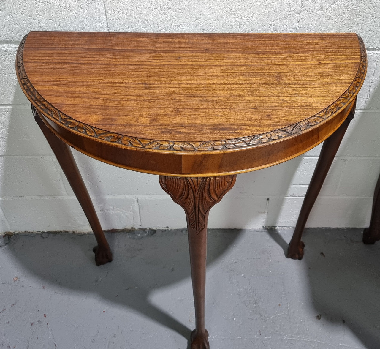 Chippendale style half round hall table. It is in good original detailed condition.