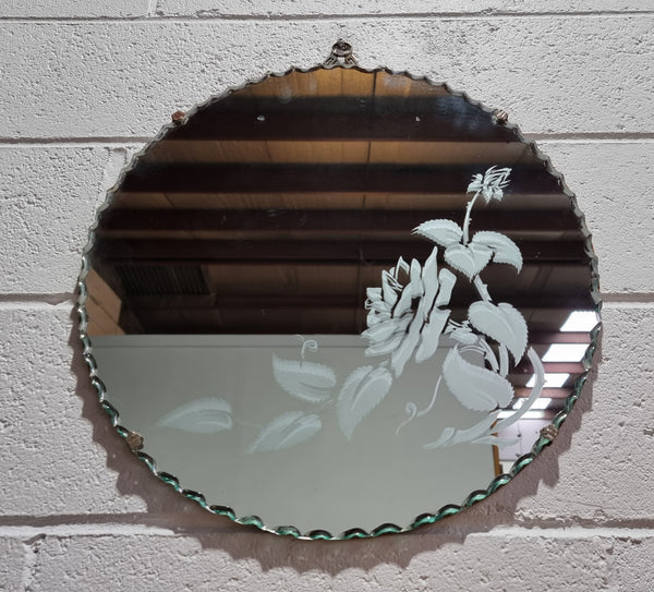 Vintage Art Deco round wall mirror with pie crust edge and etched floral design . In good condition, please see photos .