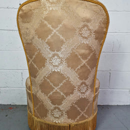 Vintage round upholstered button back bedroom chair. Beautiful gold upholstery in original condition with a gold fringe. original condition.