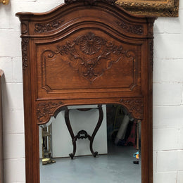 Antique French Oak Louis XV style mantle/trumeau mirror. It has its original mirror and is in good original detailed condition.