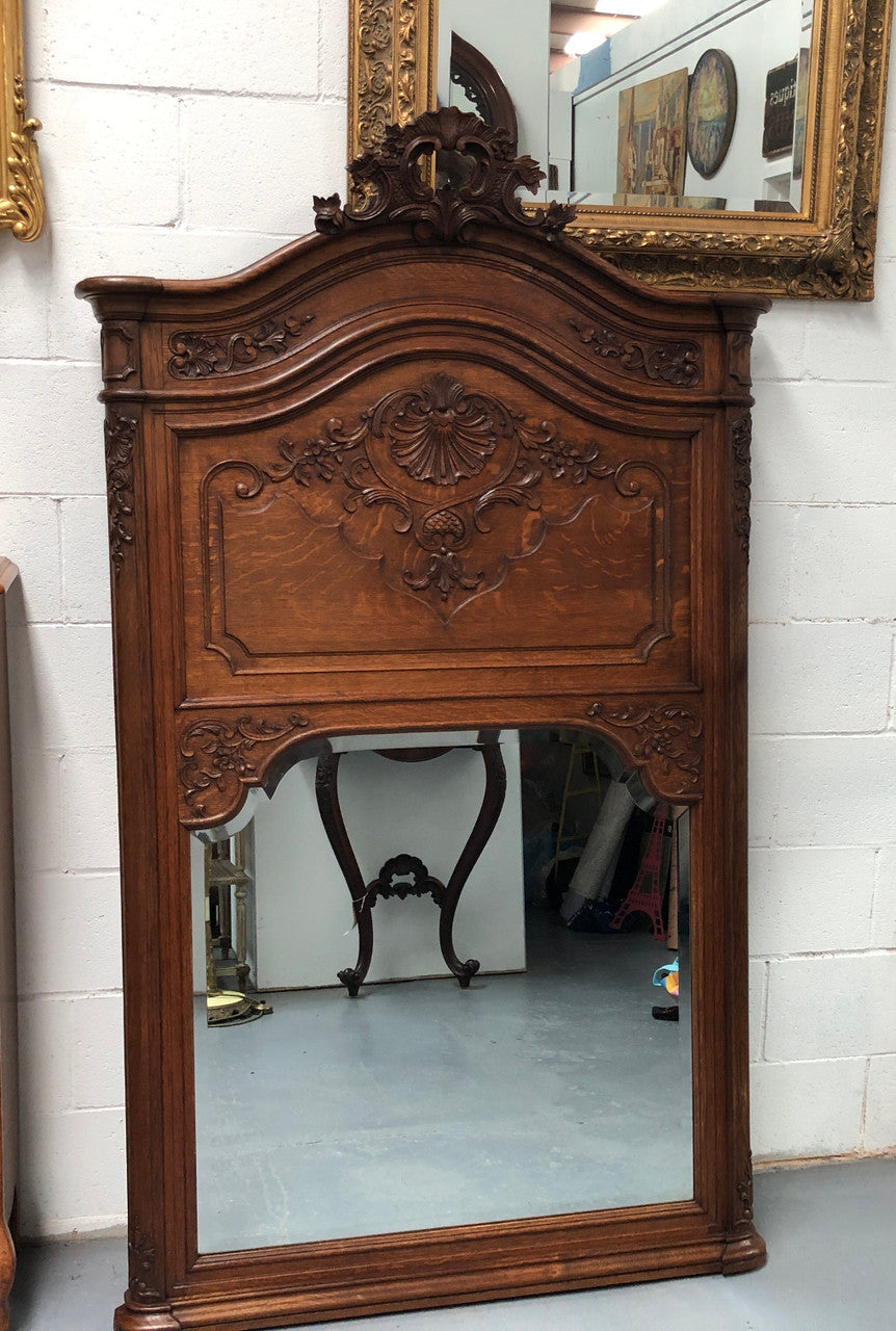 Antique French Oak Louis XV style mantle/trumeau mirror. It has its original mirror and is in good original detailed condition.