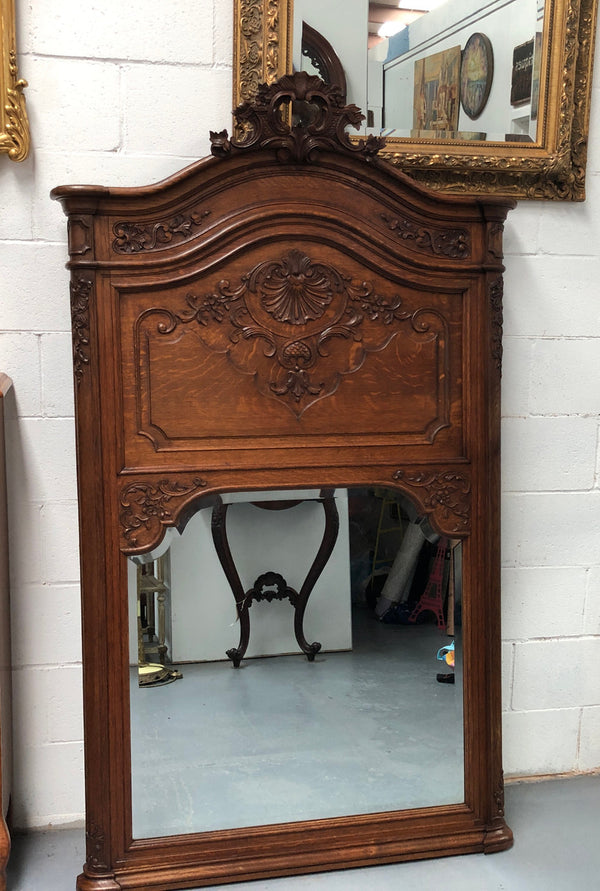 Antique French Oak Louis XV style mantle/trumeau mirror. It has its original mirror and is in good original detailed condition.