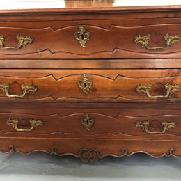 Beautiful 18th Century French all Cherrywood three drawer commode with beautiful ormolu mounts and handles. It is in good original detailed condition.
