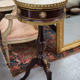 Elegant French louis XVI revival style round marble top side table with ceramic features and ormolu decoration. It is in good original detailed condition and has been sourced from France.