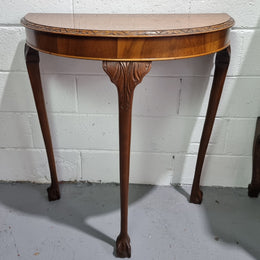 Chippendale style half round hall table. It is in good original detailed condition.