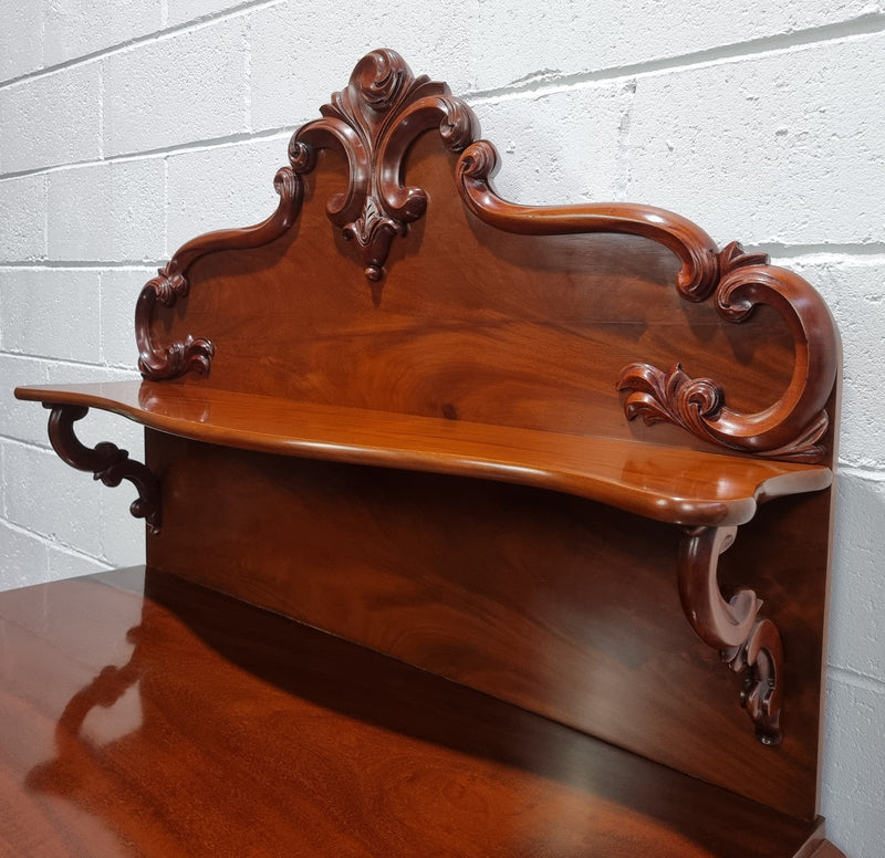 Beautiful Antique Victorian Mahogany two door Chiffonier. Plenty of storage space with one drawer and the two doors open up to a shelved area. It is in good restored condition.