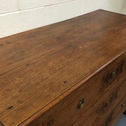 Lovely carved early 19th Century French Oak commode. There are three drawers with decorative drawer pulls and is in good original detailed condition.