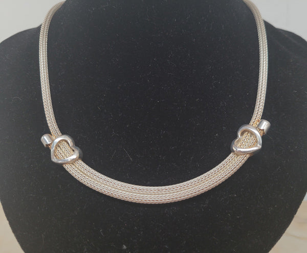 Beautiful Italian sterling silver woven double heart necklace. In good condition.