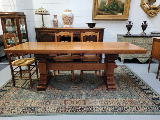 French Farmhouse table with a beautiful thick plank top and stretcher base. Can seat 8-10 people comfortably and is in good original detailed condition.