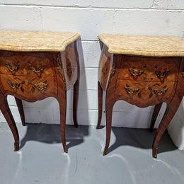 Pair of French bombe shaped commode style marquetry inlaid Kingwood bedside cabinets with marble tops and gilt brass mounts. Circa 1930 in good original detailed condition.