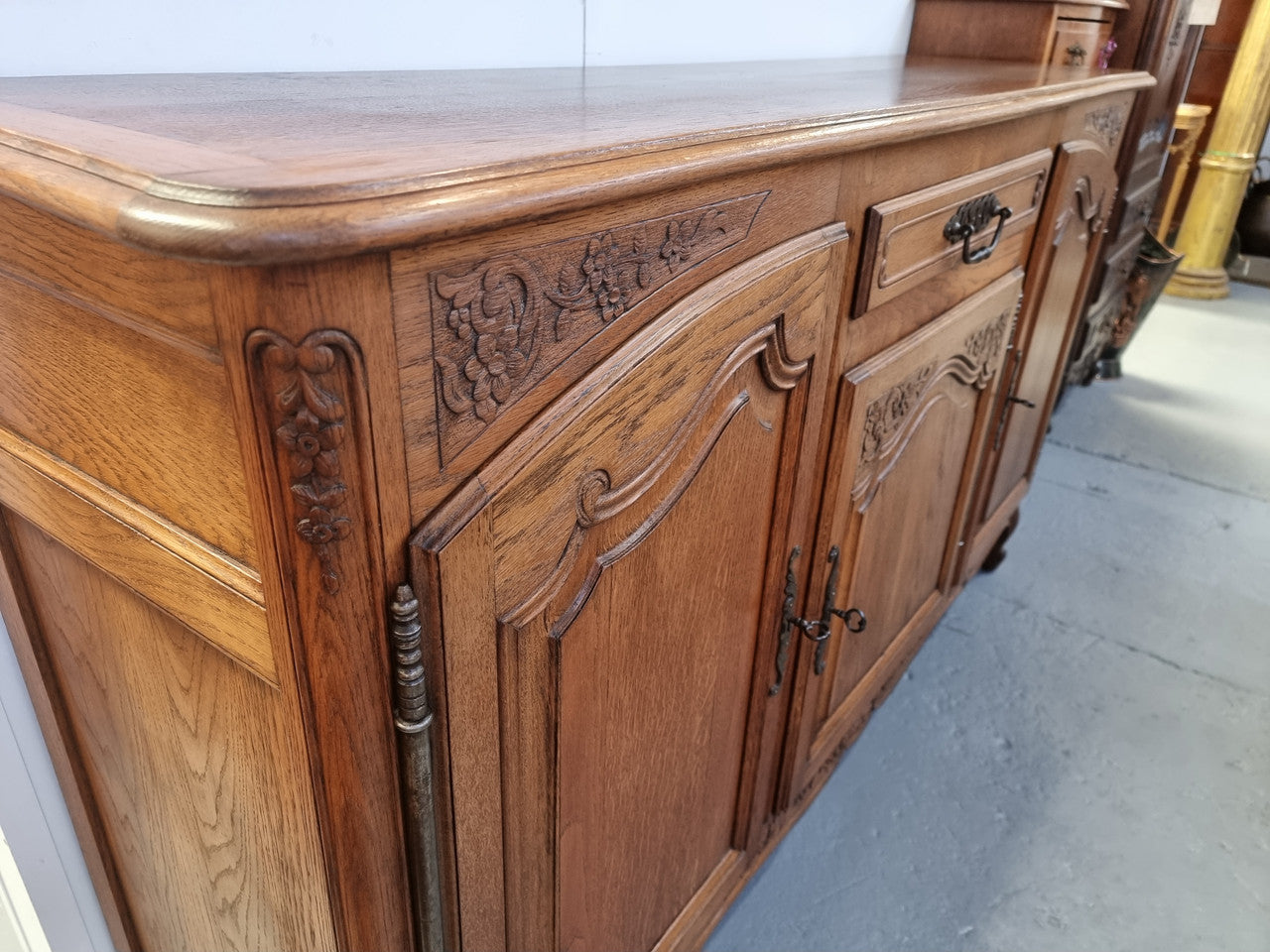 Lovely French Oak three-door sideboard with beautifully carved details and there is also a drawer. In good original detailed condition.