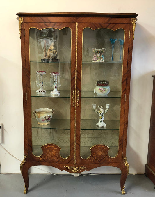 19th Century ornate French Walnut marquetry inlay display cabinet. Has beautiful ornate ormolu mounts and its original glass. In good original detailed condition.