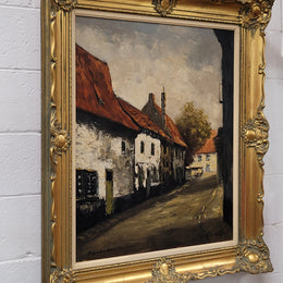 Dutch signed oil on canvas depicting village street in a beautiful gilt frame. It is in good original detailed condition and has been sourced from France.