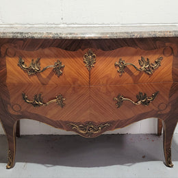 Stunning French Walnut and Rosewood Louis XV style two drawer commode with a beautiful marble top and ormolu mounts. In good original detailed condition.