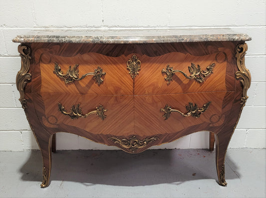 Stunning French Walnut and Rosewood Louis XV style two drawer commode with a beautiful marble top and ormolu mounts. In good original detailed condition.