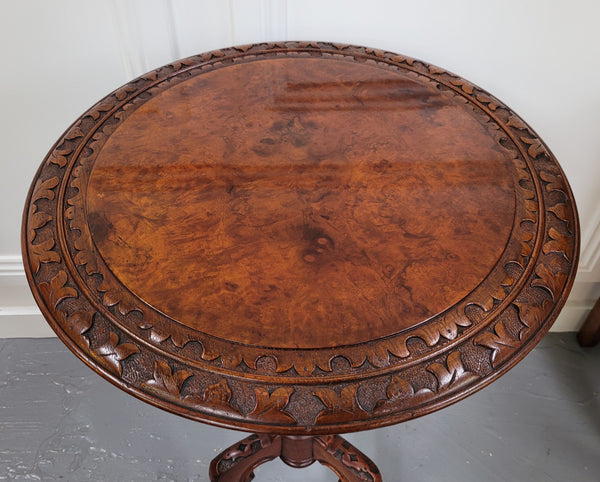 Rare early Victorian Irish Burr Walnut wine table. It has a beautiful carvings and a stunning burr walnut top, on a barley twist column and three shaped legs. It has been sourced locally and is in good original detailed condition. We also have a second table being sold separately which when together make a matched pair.