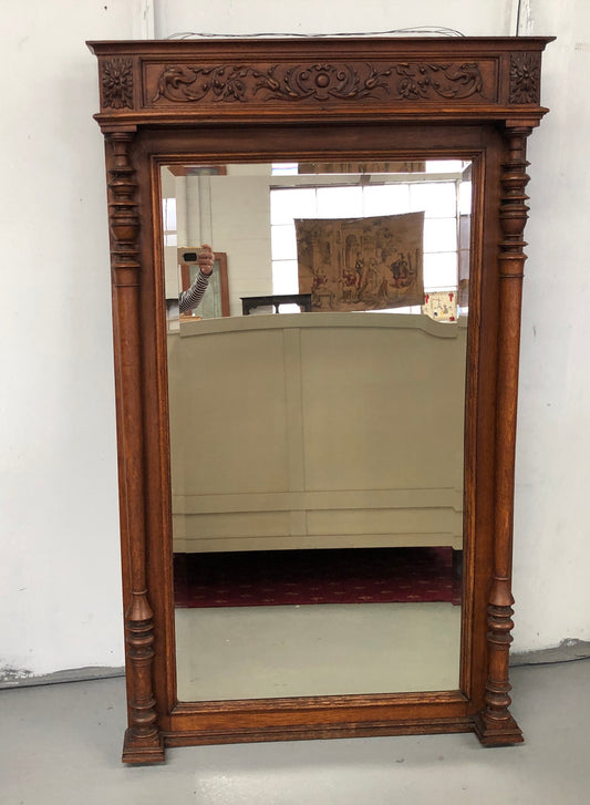 Beautifully carved French Henry II style Oak mantle mirror. Contains original glass and is in very good original detailed condition.