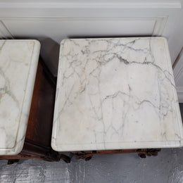 Pair of French Antique Louis XV style Oak marble top night stands. They have beautiful carved cabriole legs and beautiful white marble along with a drawer and cupboard for storage space. They have been sourced from France and are in good original detailed condition.
