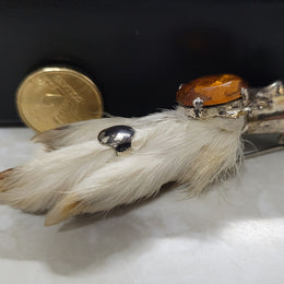 Scottish Grouse foot with Amber coloured glass. In good original condition, please view photos as they help form part of the description.