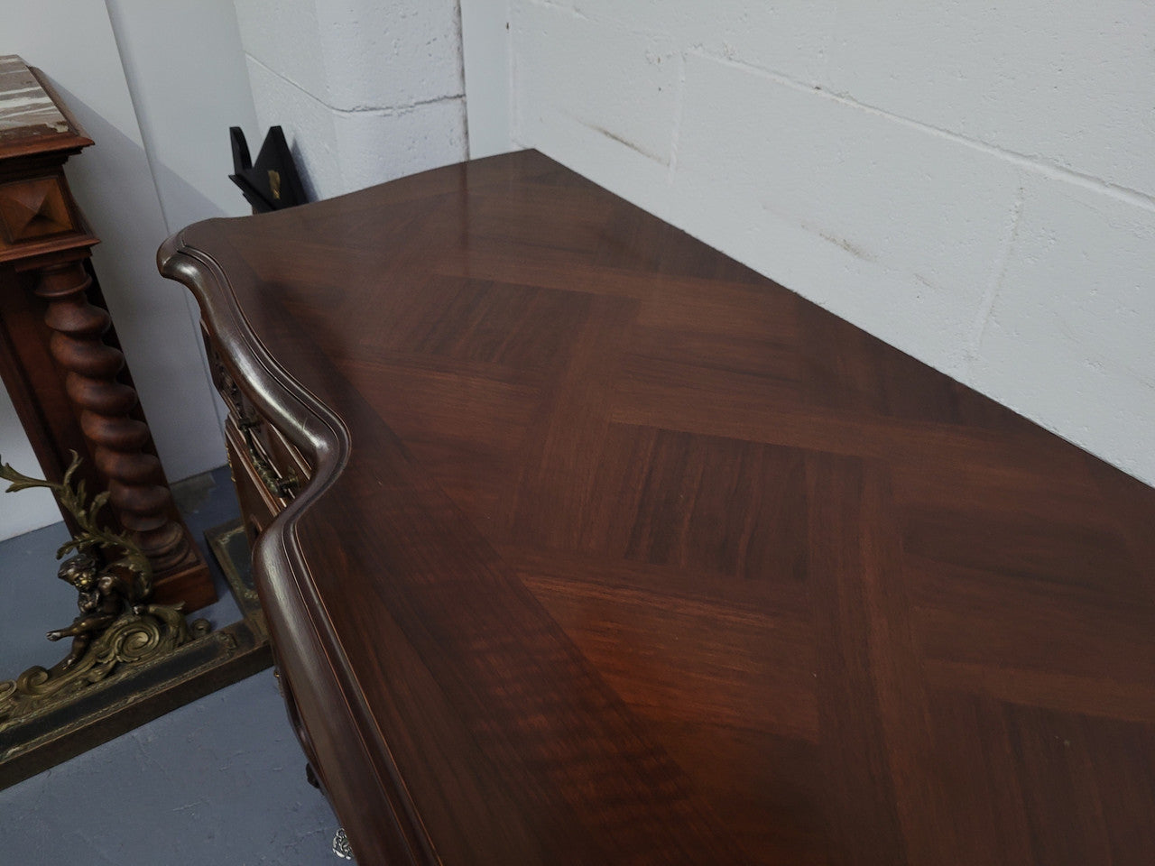 Fabulous Louis XV style French Walnut and Burr Walnut four door sideboard. Each door panel has beautiful Burr Walnut panels and open up to an adjustable shelf. Beautiful handles and two drawers for added storage. In good original detailed condition.