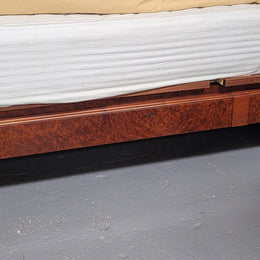 French Art Deco bedroom suite consisting of queen size bed in Amboyna wood and featuring pretty inlay. It comes with a matching pair of bedsides. It is a very stylish and high quality suite. It has been sourced from France and is in good original detailed condition.