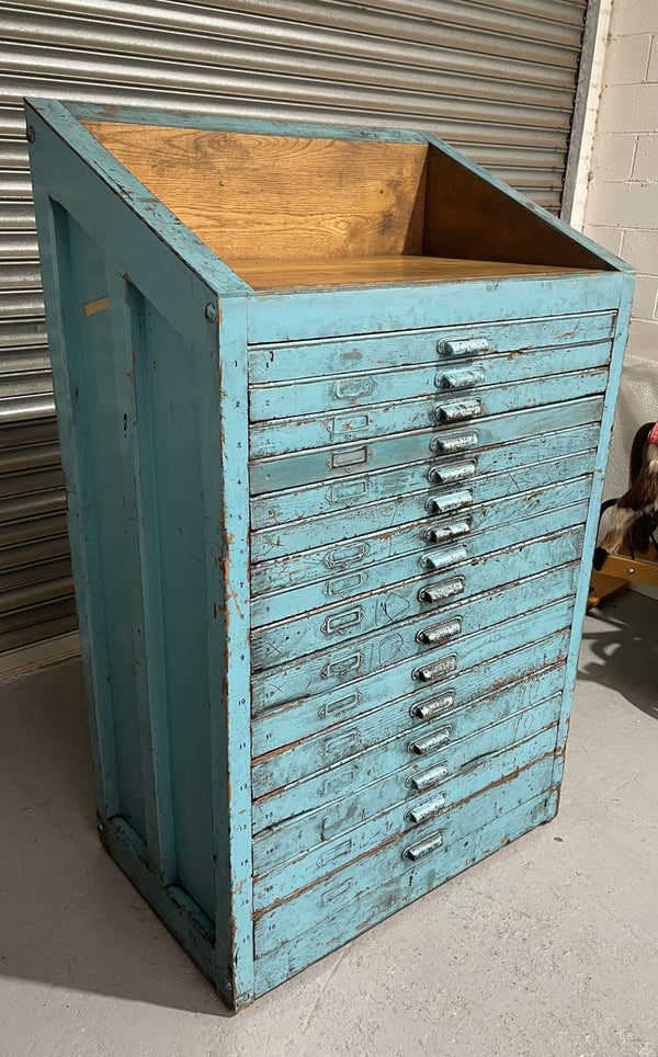 Fabulous set of vintage painted blue printers drawers that have adjustable separators which can be taken out for large papers. The drawers are various sizes and there is a section on top for working on or for storing brushes or tall items . These would be perfect for artists or jewellery pieces or even architects. Such a beautiful piece of industrial furniture.