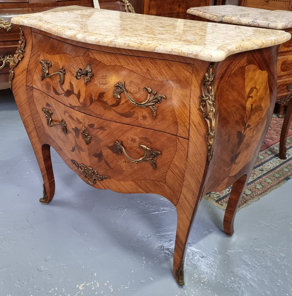 Fabulous French petite inlaid two drawer commode with ormolu mounts and lovely marble top. It is in good original detailed condition.